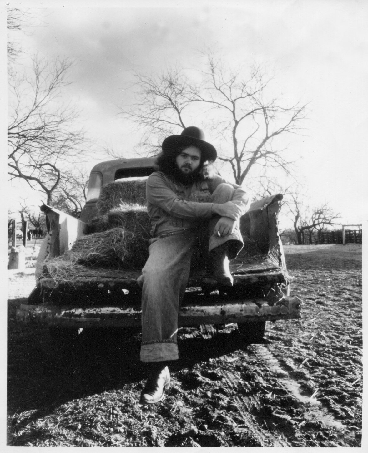 B. W. Stevenson, sitting on the bed of a pickup truck